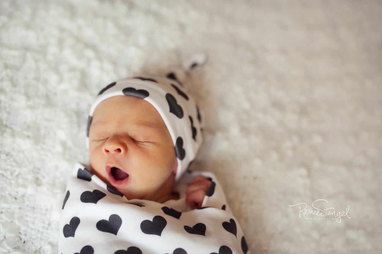 Newborn in Heart Swaddle and Hat in Black and White on Cream by RENEE STENGEL Photography | Charlotte Portrait and Underwater Photographer