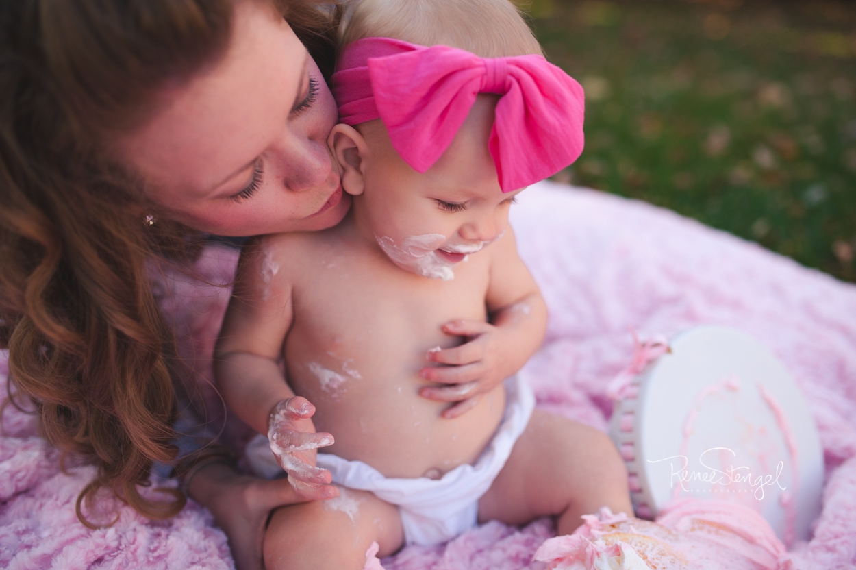 Mama and Baby Girl during Outdoor Cake Smash in Pink by RENEE STENGEL Photography | Charlotte Underwater and Portrait Photographer | 