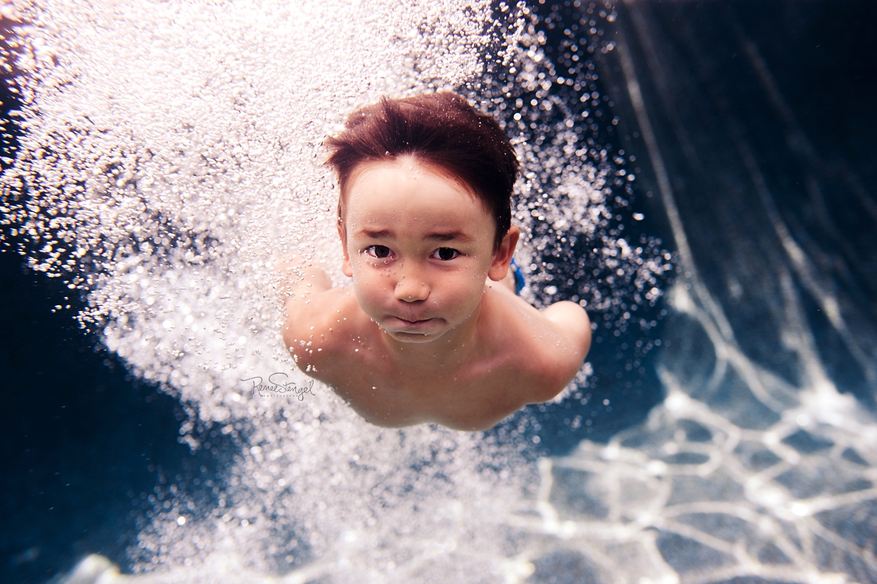 RENEE STENGEL Photography | Charlotte Portrait and Underwater Photographer | Underwater Family Boy Diving In | Bubbles