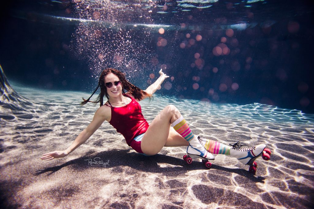 Charlotte Underwater Roller Derby Girl with Dreads and Rainbow Striped Socks by RENEE STENGEL Photography | Charlotte Underwater Photographer | 
