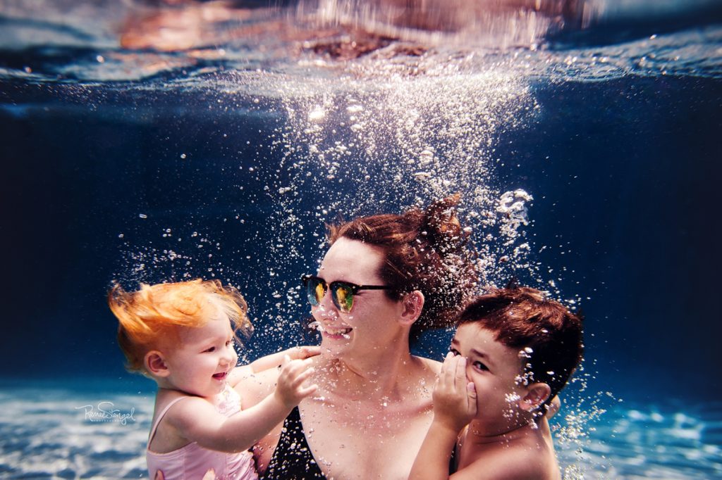 Mom with Baby Sister and Big Brother Underwater by RENEE STENGEL Photography | Charlotte Portrait and Underwater Photographer | 