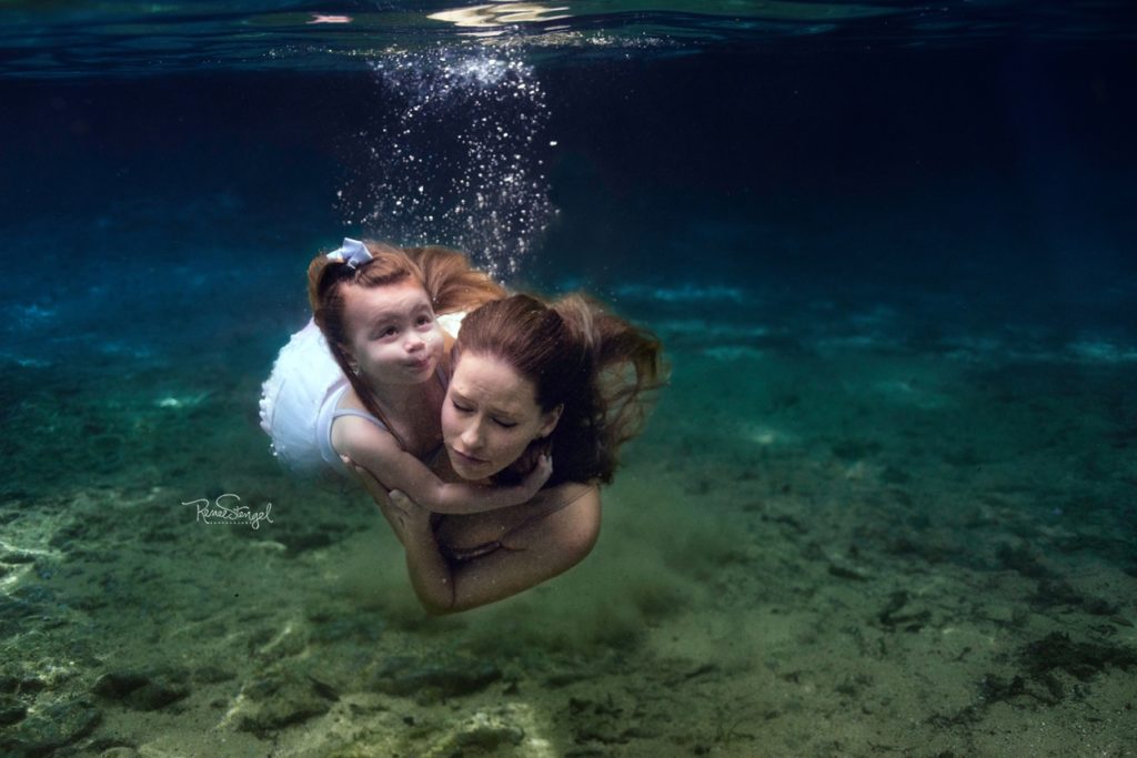 Underwater Maternity Mama with Toddler girl swimming Under the water in Florida's Ginnie Springs