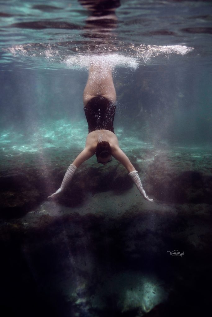 Charlotte Underwater Glam Senior Freediving in Black Swimsuit and pearls