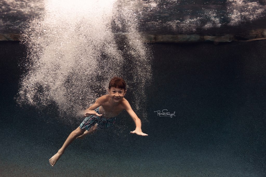 Boy jumping in pool with underwater bubbles by RENEE STENGEL Photography | Charlotte Underwater and Portrait Photographer | 