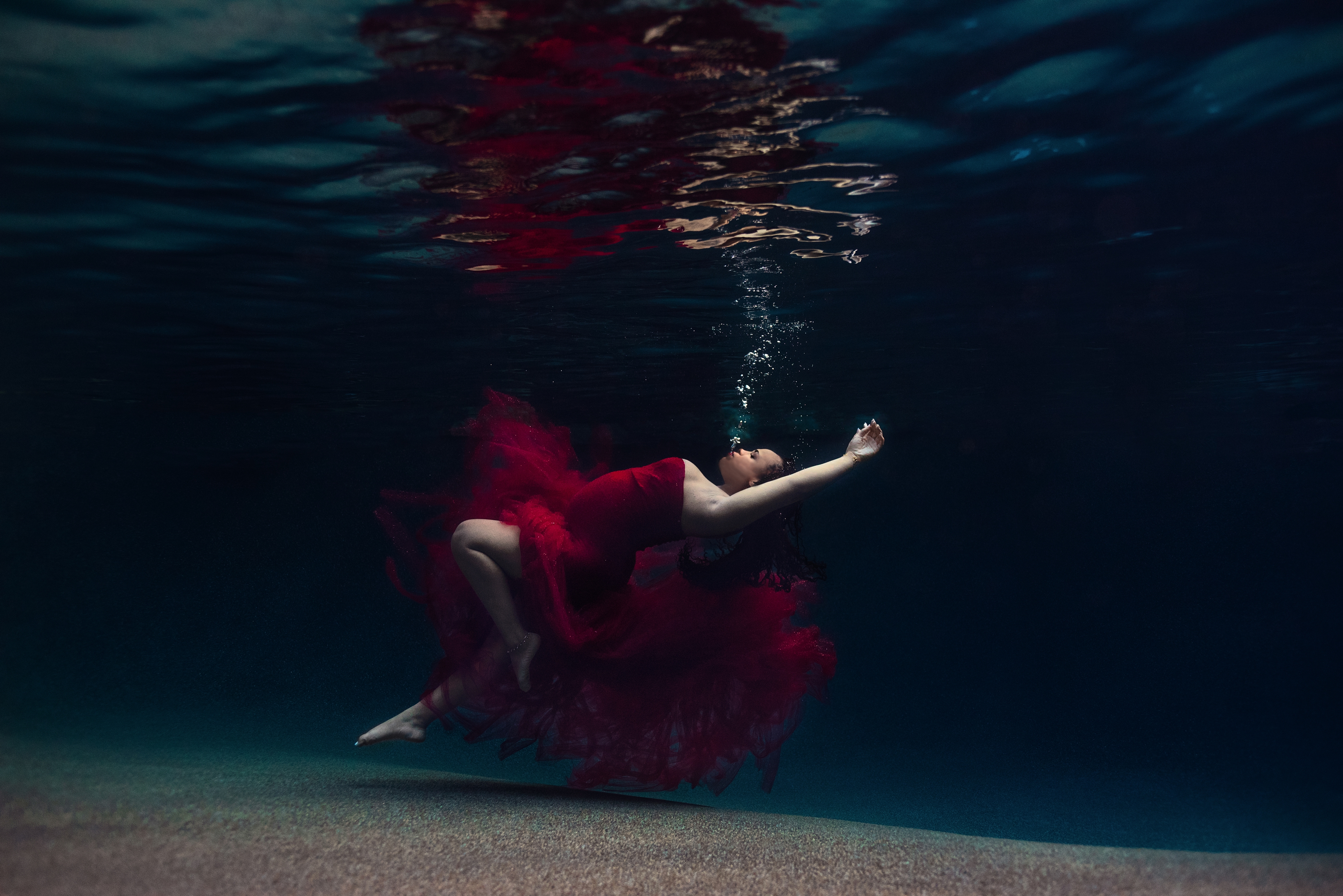 Underwater Maternity in Dramatic Sew Whimsey Red Celine Couture Tulle and Lace Gown