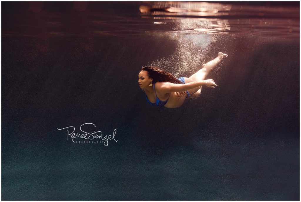 Pregnant Black Girl Swimming Underwater in Deep Dark Blue Water in Cobalt Blue Bikini