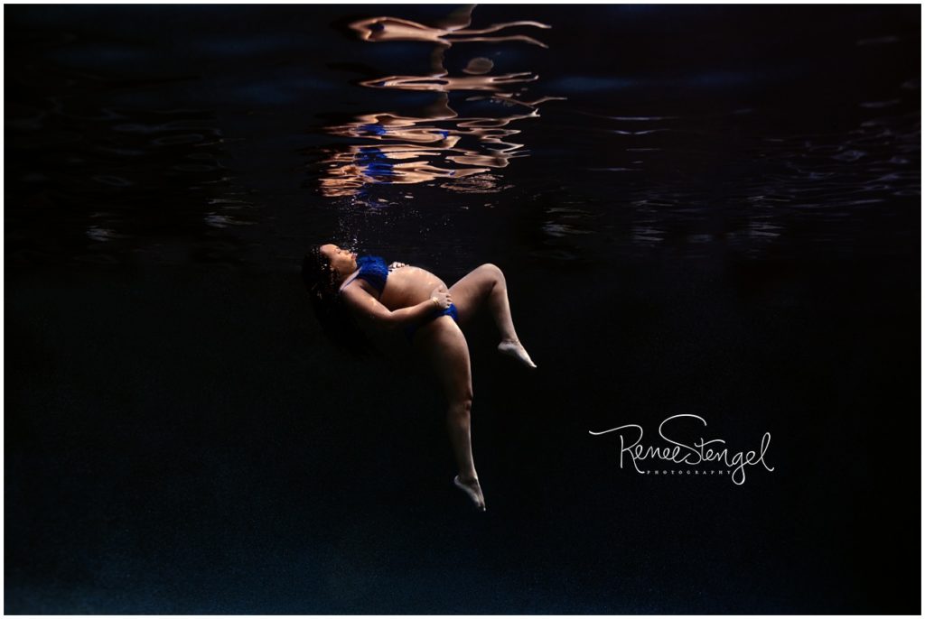 Pregnant Black Girl Sinking Underwater in Deep Dark Blue Water in Cobalt Blue Bikini for Underwater Maternity Photography