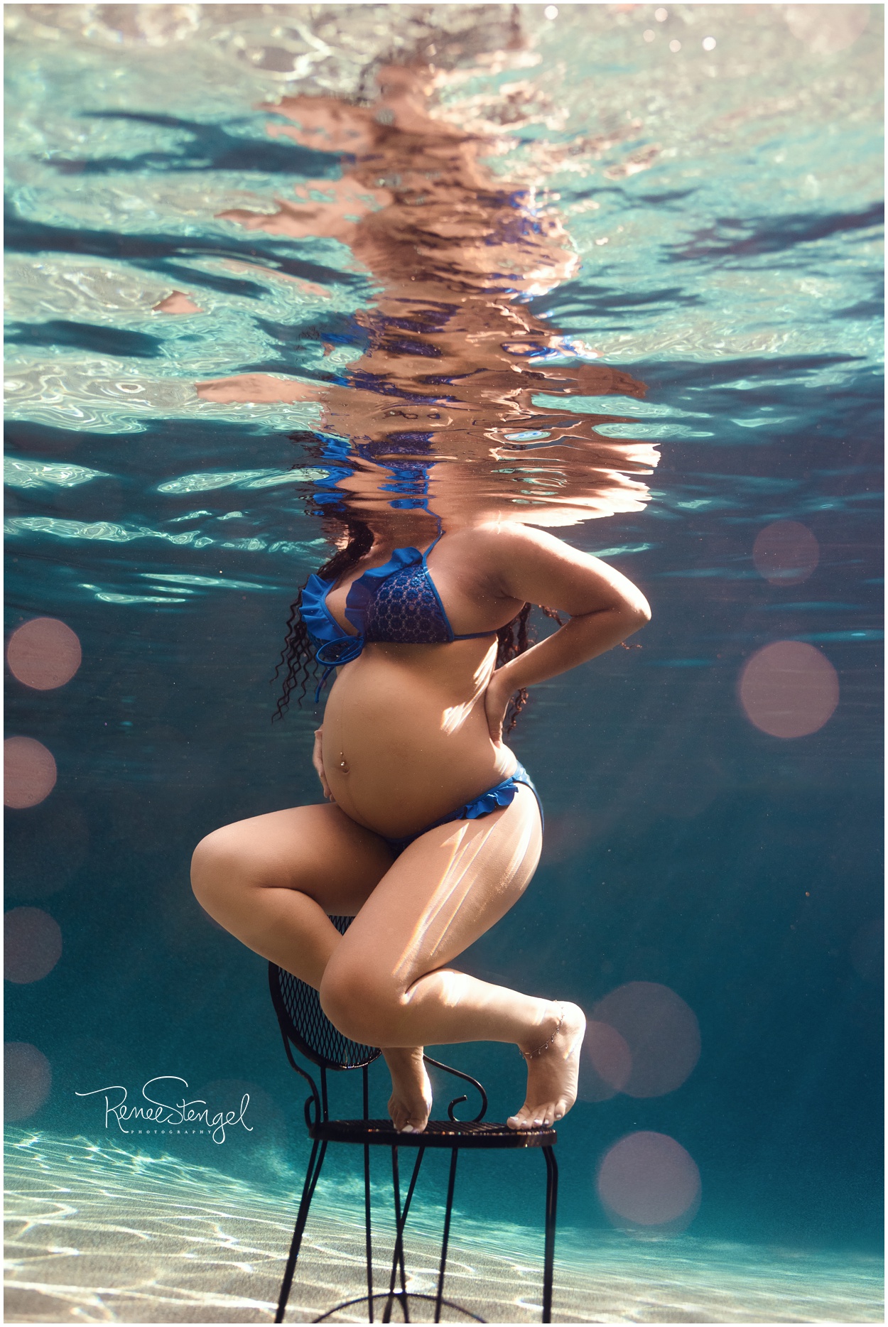 Pregnant Black Girl Posing Underwater in Tropical Blue Water in Blue Bikini