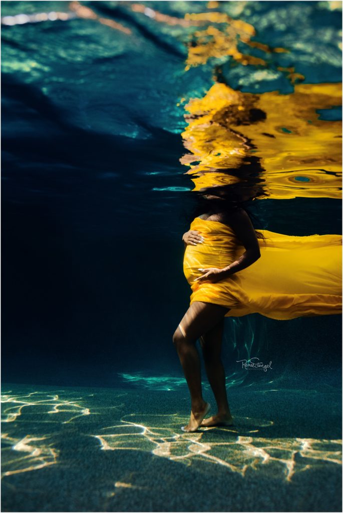 Underwater Maternity Portraits with non swimmer using Golden Yellow Chiffon in a deep blue pool