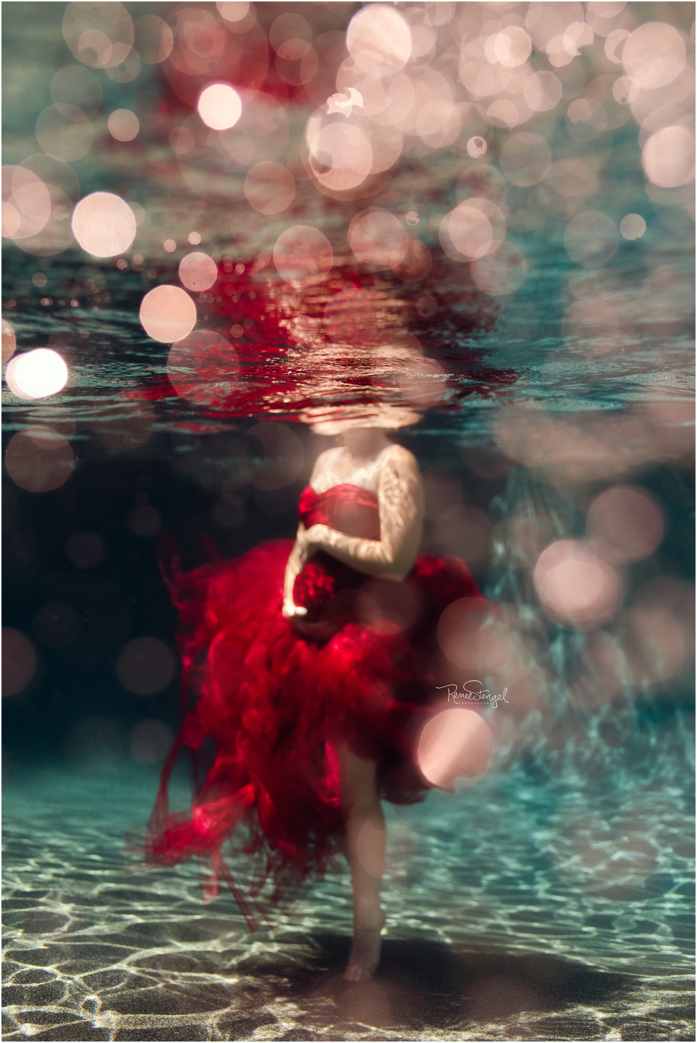 Underwater Maternity Portrait in Red Tulle Couture Gown
