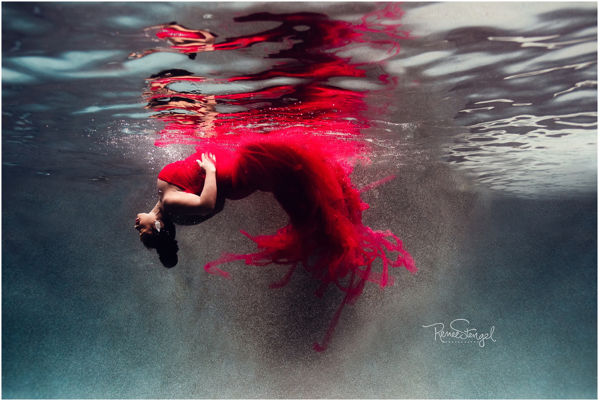 Unique Underwater Maternity Portrait of African American Woman in Red Tulle Couture Gown