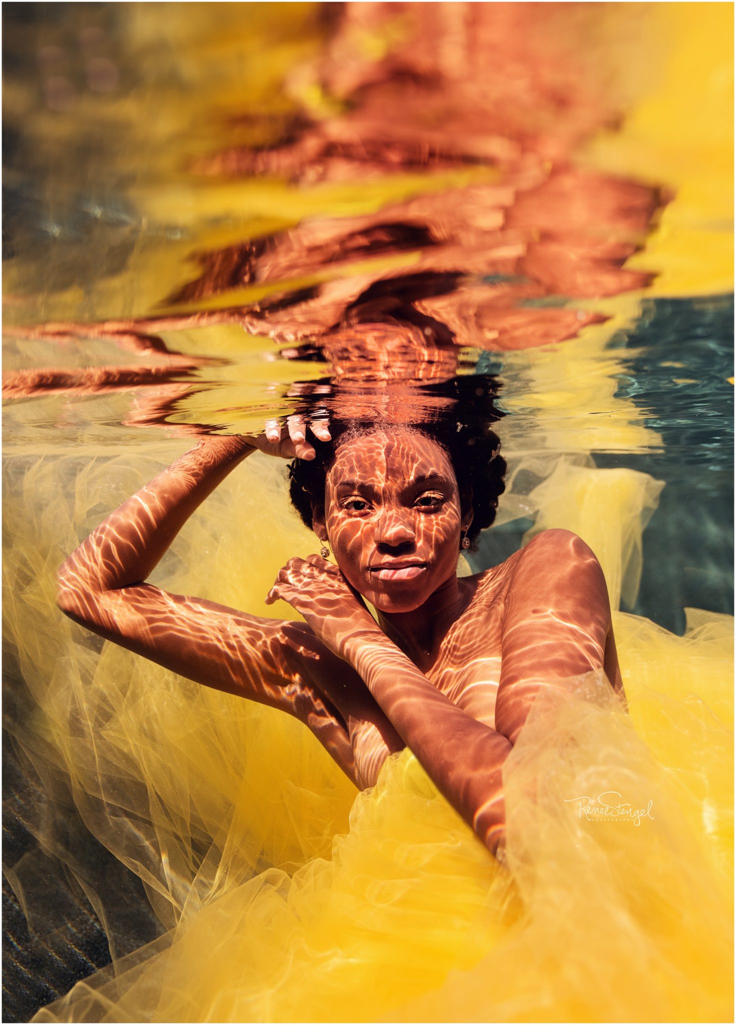 Black model in yellow underwater
