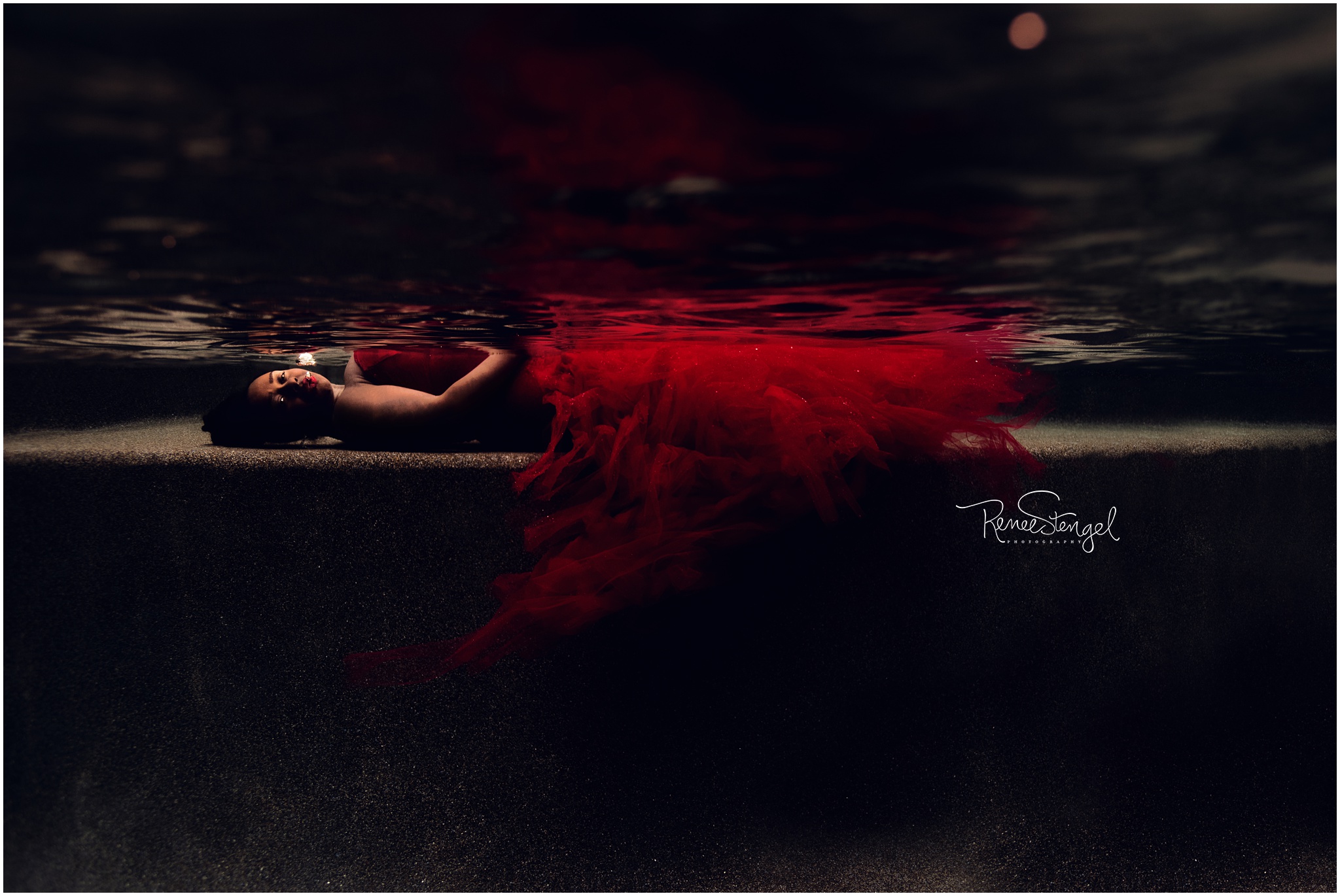 African American with seductive look Underwater in Red Tulle Celine Couture Maternity Gown