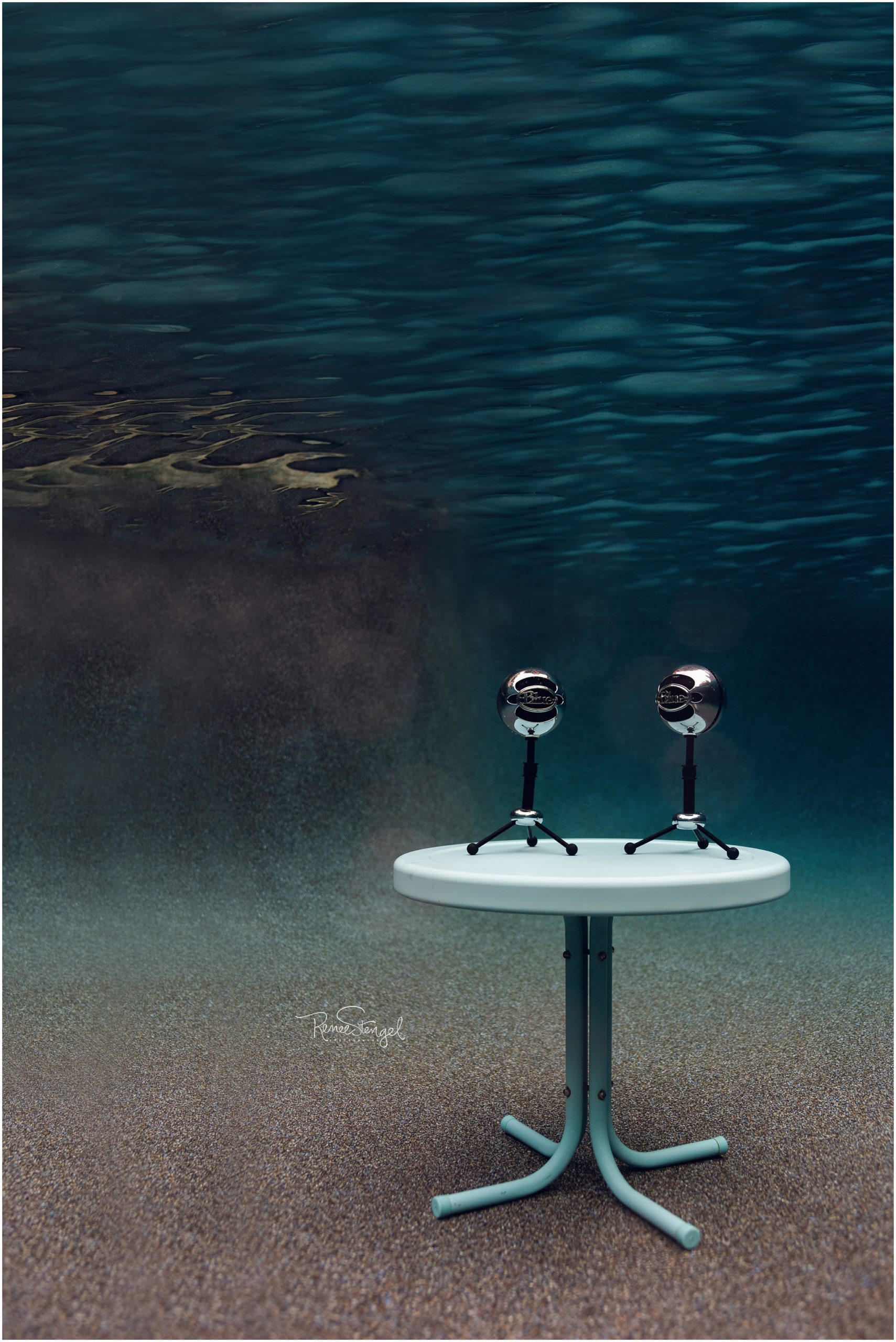 Pair of Blue Snowball Podcast Mics Underwater on Tiffany Blue Table