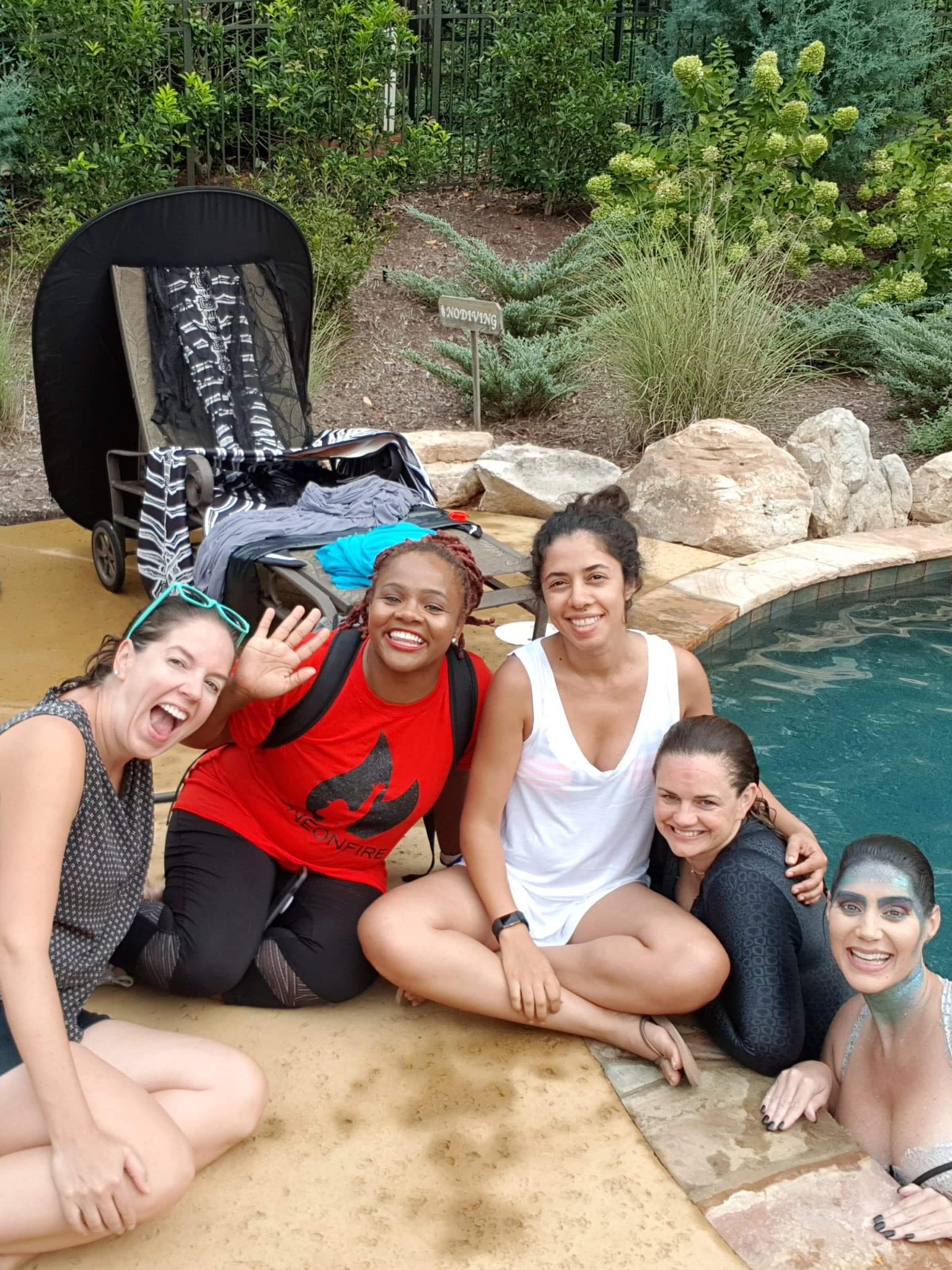 White, Black, and Muslim women by pool after styled underwater Photography mermaid session