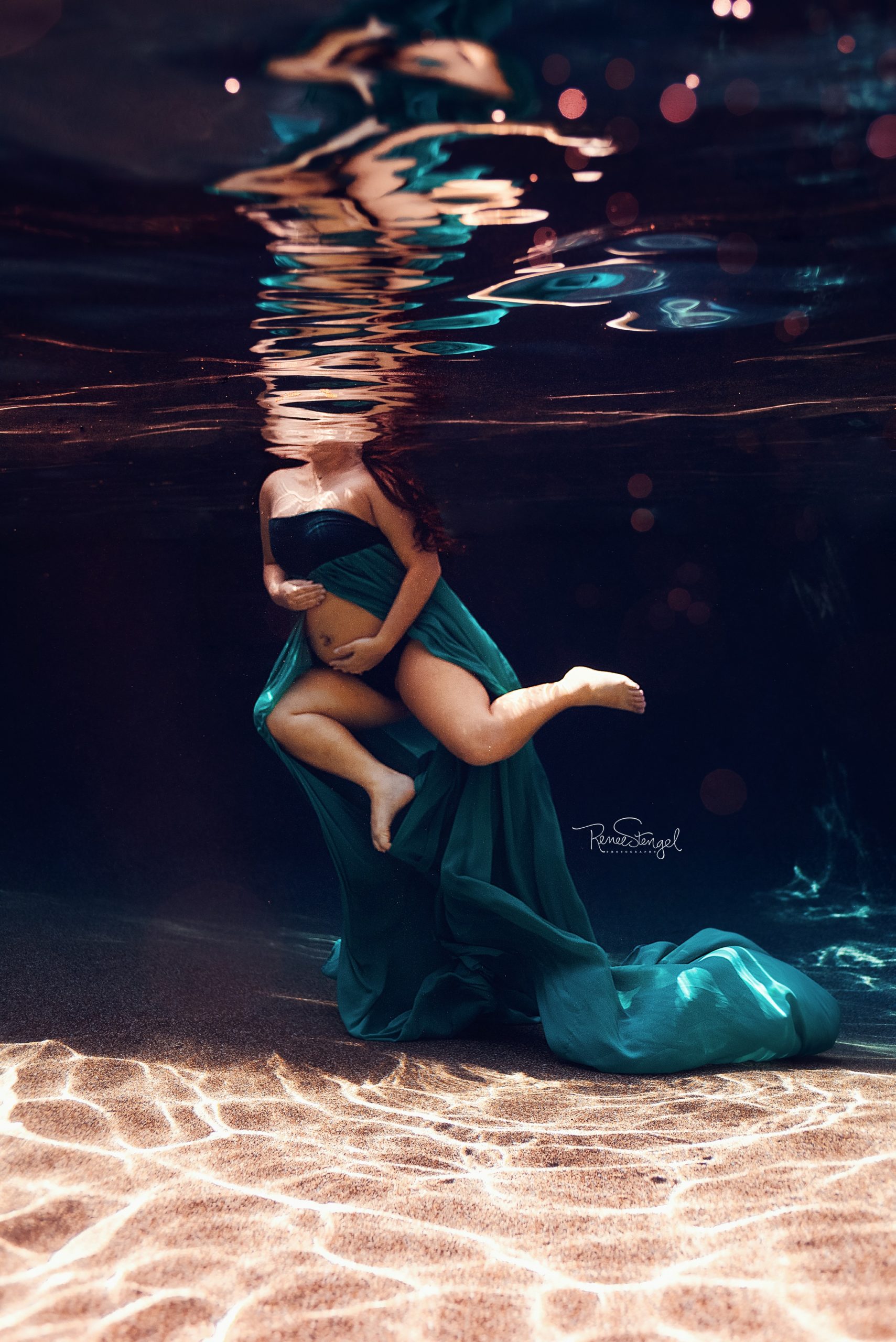 Underwater Maternity in Shallow Water looking towards the deep with Asian woman and Teal Gown