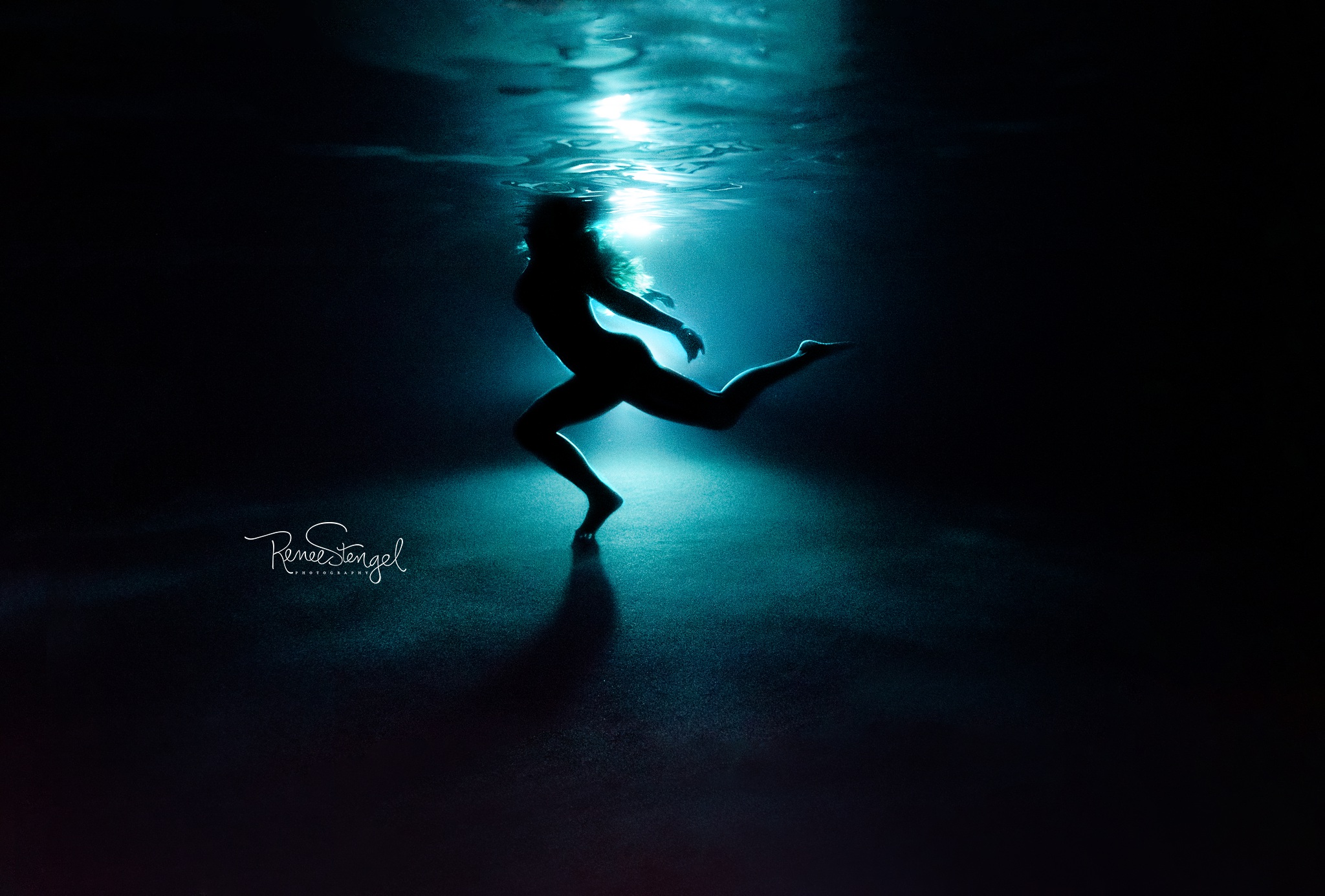 Backlit Underwater Dancer at night